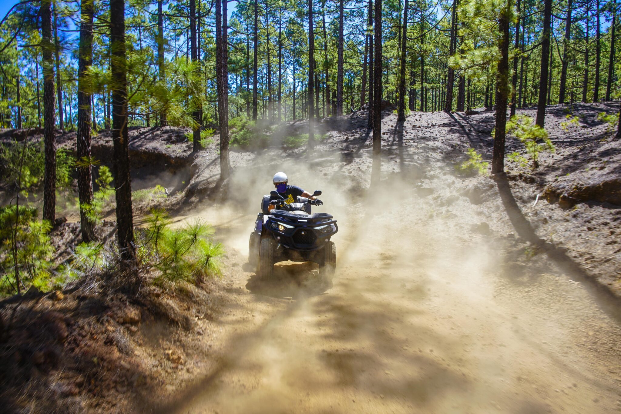 Quad with loads of dust in the Corona Forest in Teide